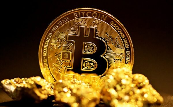 Bitcoin beside gold representing Bitcoin ETF and gold ETF demand comparison